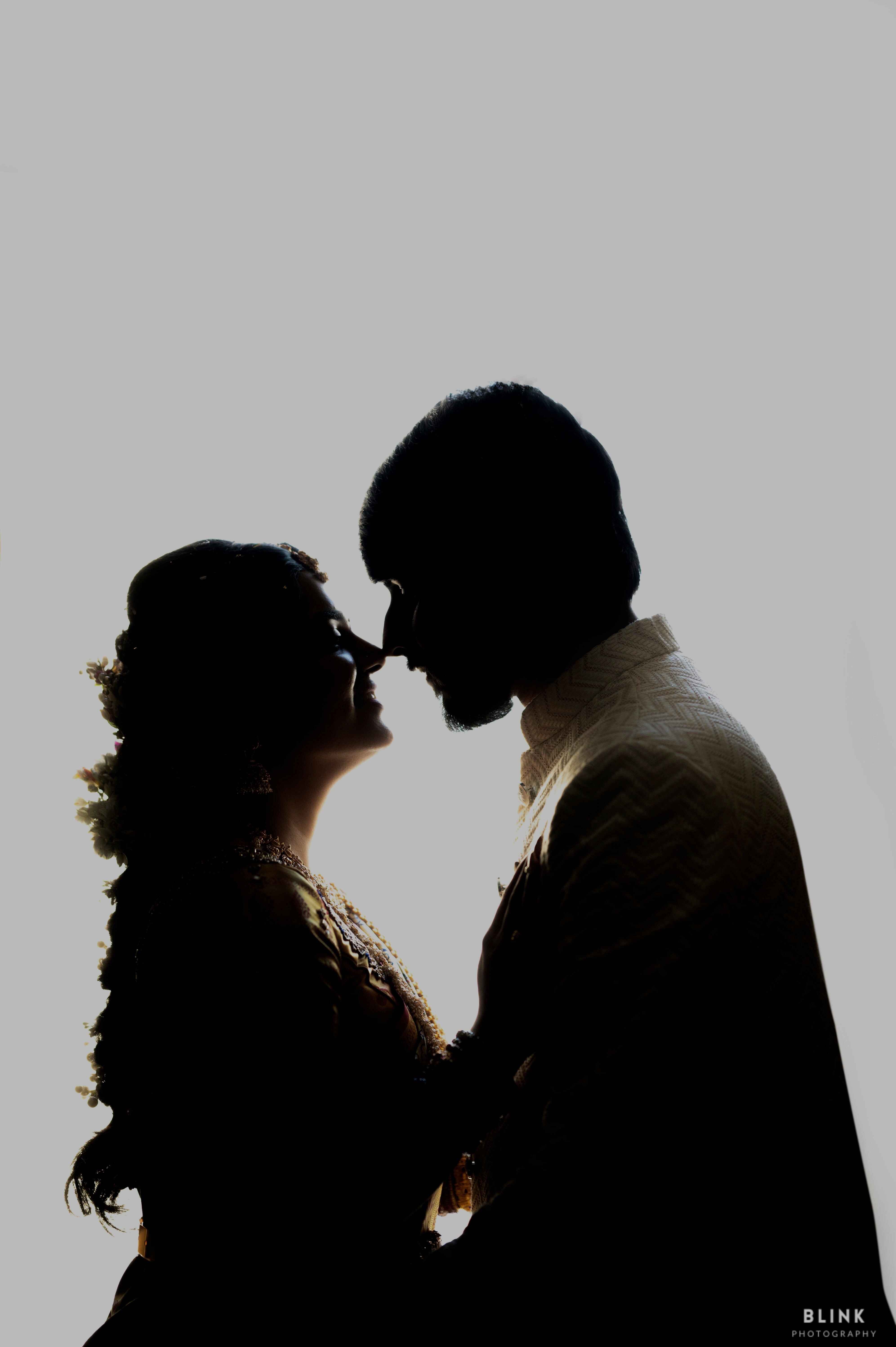 Bride & groom couple pic with white background and stunning phose with dark shadow effect