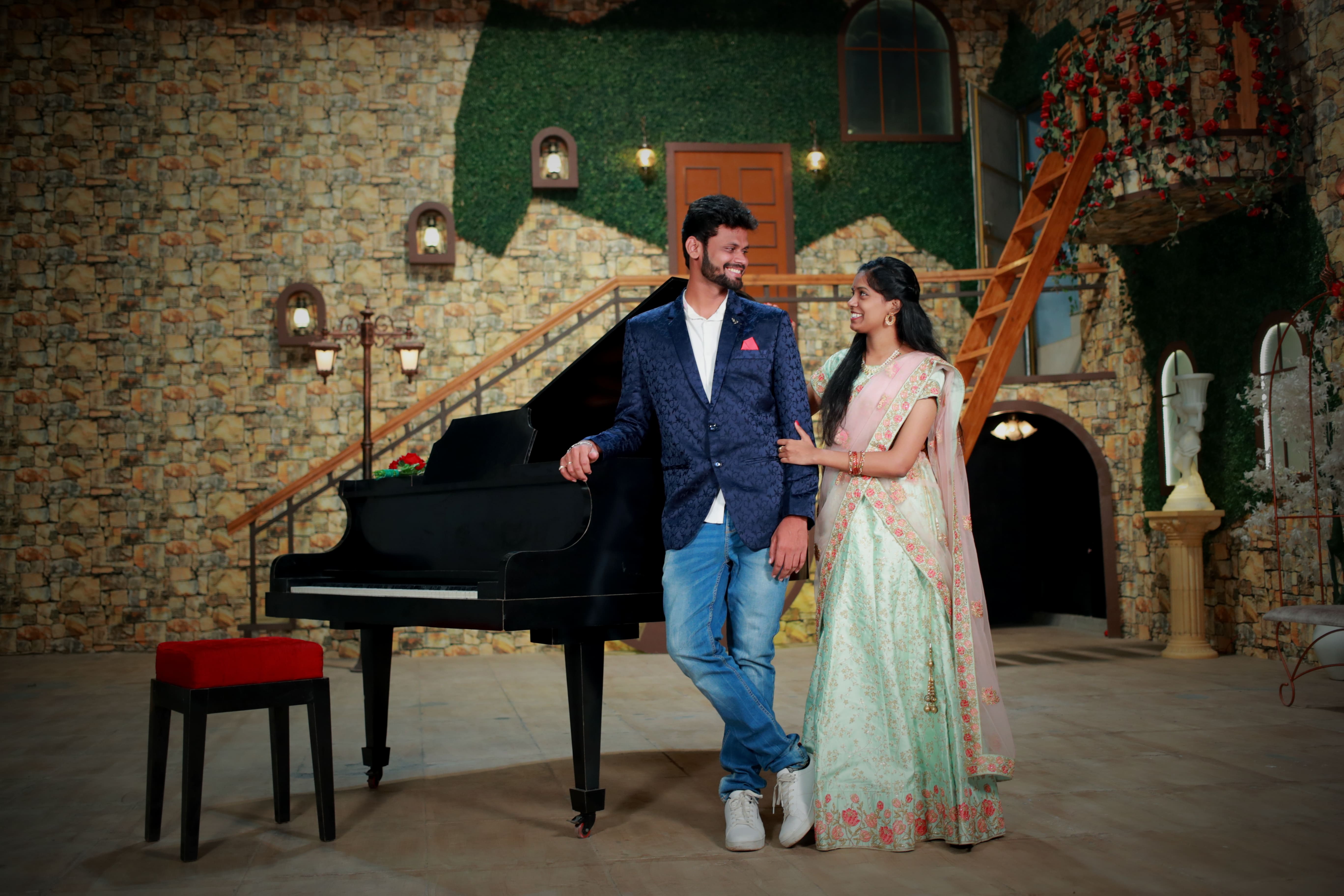 Couple posing with piano, pre-wedding shoot